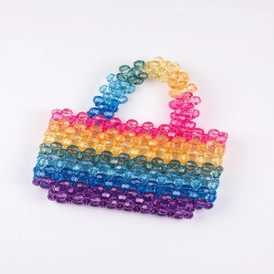 Macro shot of colorful faceted beads on a handmade summer tote bag showing vibrant texture