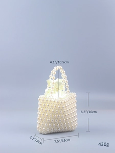 Detailed view of woven pearl handbag with measurements 19x8x16cm and inner satin bag