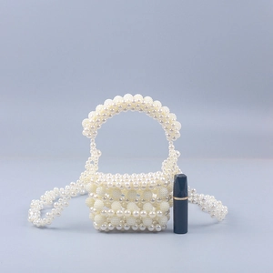 Handmade mini beaded pearl handbag with woven top handle and long crossbody strap