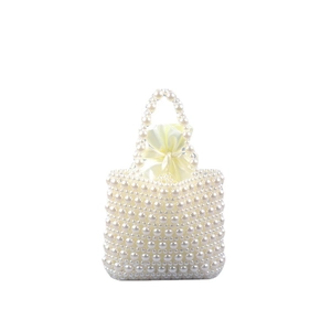 Elegant white faux pearl beaded tote bag with a cream drawstring satin inner pouch