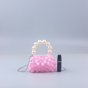 Pink handmade acrylic beaded mini handbag with white pearl handle and metal chain