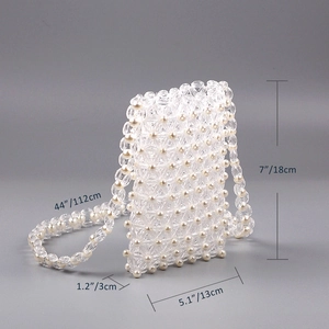 Detail view of handmade beaded phone bag with 18x13x3cm dimensions and 112cm strap