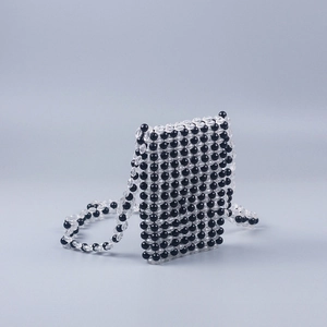 Handmade beaded crossbody bag with black and clear acrylic beads in geometric pattern