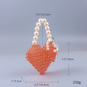 Detail of pink acrylic beaded heart bag with pearl handle and ribbon showing exact dimensions