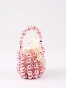 Detail of pink beaded bucket bag with white satin drawstring liner and metal lobster clasp