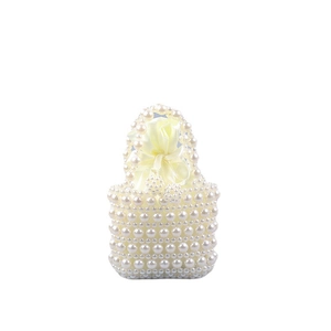 Handmade cream pearl beaded tote bag with a yellow drawstring satin inner pouch