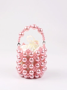 Detail of pink handmade beaded bucket bag featuring faux pearls and satin drawstring lining