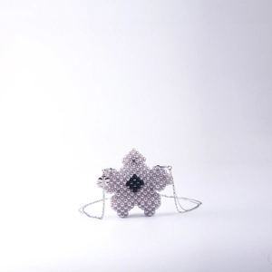 Handmade purple beaded flower mini bag with black detail and silver chain strap