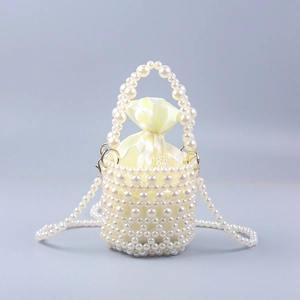 Elegant pearl beaded bucket bag with yellow satin drawstring liner and crossbody chain