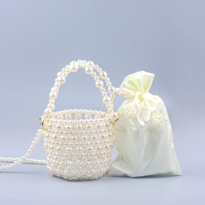 Elegant pearl bucket bag with hollow woven design and satin drawstring inner pouch