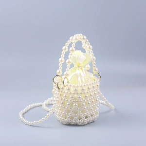 Elegant pearl bucket bag with woven structure, yellow satin pouch and crossbody chain