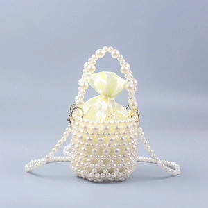 Handmade pearl beaded bucket bag with yellow satin drawstring liner and shoulder chain