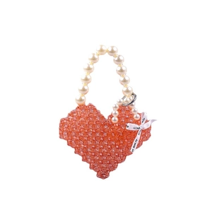 Handmade orange heart-shaped acrylic beaded handbag with large pearl handle and ribbon