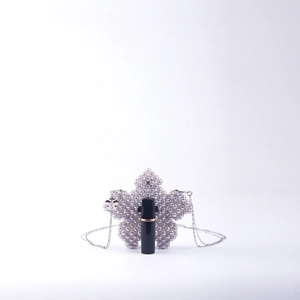Handmade pink pearl star-shaped mini crossbody bag with silver chain strap and charm