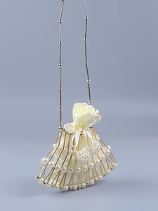 Detail of beaded fan-shaped mini bag with gold metal frame, pearls and satin drawstring