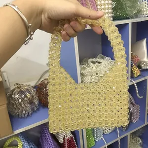 Handmade beaded acrylic handbag in amber yellow with retro woven handle design