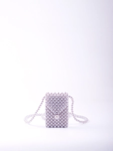 Detailed close-up of handmade beaded mini bag with pearlescent gray beads and long strap