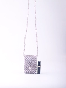 Detail of lavender handmade beaded mini crossbody bag with pearl clasp and size reference