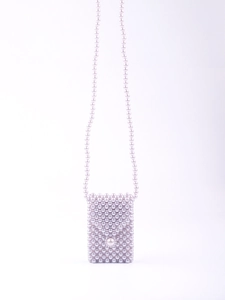 Close-up of handmade woven pearl mini crossbody bag with elegant purple beads