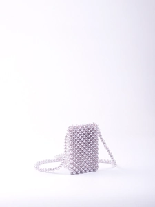 Detailed view of lavender hand-woven pearl beaded mini crossbody bag with matching strap