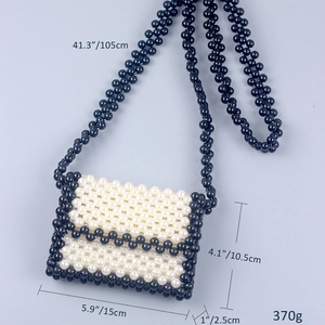 Detailed size specifications of a handmade woven pearl crossbody bag with black accents