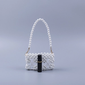 Handmade woven white faux pearl mini evening handbag with golden metal hooks