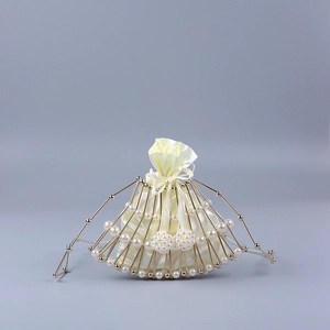 Detail of fan-shaped pearl evening bag with golden metal frame and satin inner pouch