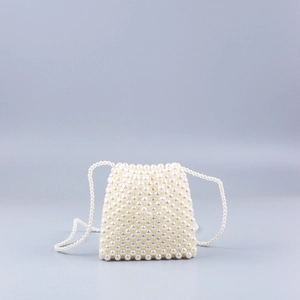 Close-up of handmade pearl beaded crossbody bag featuring high-gloss acrylic beads
