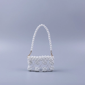 Handmade pearl beaded mini handbag featuring hollow petal patterns for evening parties