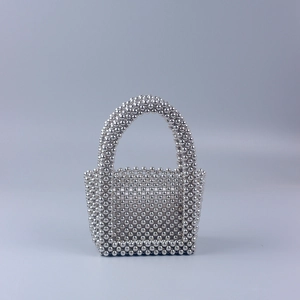 Handmade woven silver pearl evening bag with U-shaped handle and metallic finish beads