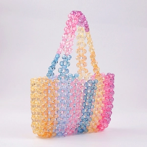Detail of multi-color rainbow acrylic beads and hand-woven texture on this beaded handbag
