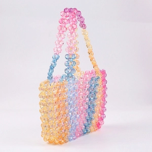 Handmade rainbow beaded tote bag with colorful gradient beads and double handles