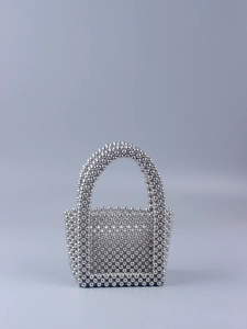 Detailed close-up of handmade mini U-shaped handbag woven with metallic silver acrylic beads