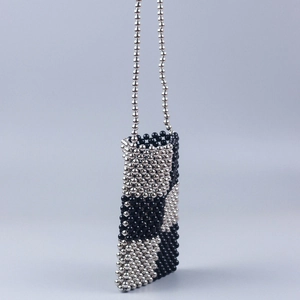 Handmade beaded mini crossbody bag with silver and black checkered pattern and strap