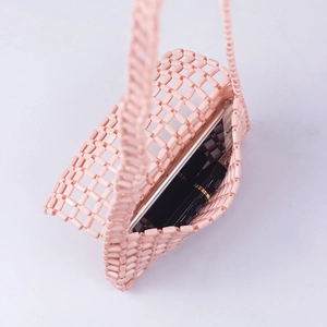 Pink acrylic beaded tote bag showing internal capacity for phone and lipstick