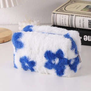 Detail of plush floral pencil case with soft texture and silver metal zipper pull