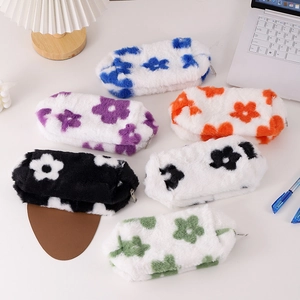 Cute floral plush pencil cases in six vibrant colors for students shown on a desk