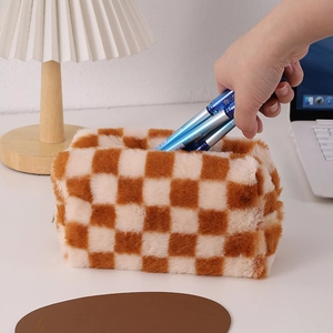 Macro view of plush checkered pencil case showing thick fabric texture and large capacity