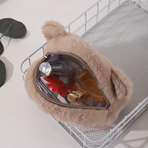 Cute brown plush bear coin purse storage bag for cosmetics and earphones on white basket
