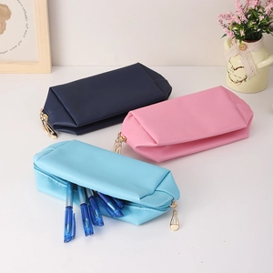 Waterproof PU leather cosmetic bags in blue and pink with metal zippers and large interior
