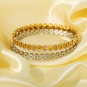 Elegant gold and silver stackable bracelets with hollow H-pattern and small cubic zirconia