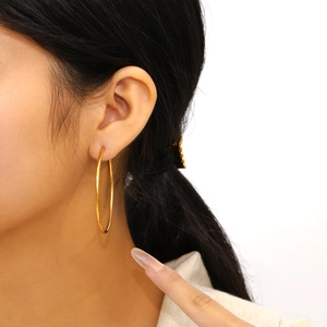 Statement gold plated stainless steel hoop earrings in a glossy oversized circular design