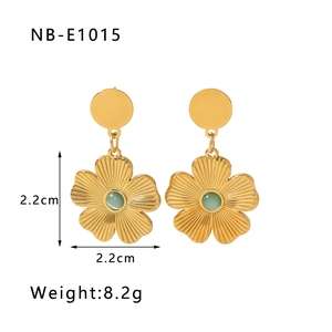 Detail showing 2.2cm 18k gold-plated flower earrings with green cat eye stone insets