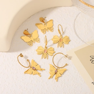 French vintage butterfly earrings set with pink gemstone and purple zircon details
