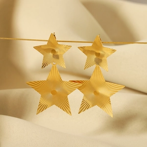 Elegant 18k gold plated stainless steel double star dangle earrings on soft fabric