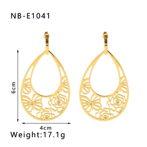 Detail view of 6x4cm gold-plated teardrop earrings with hollow rose and butterfly pattern