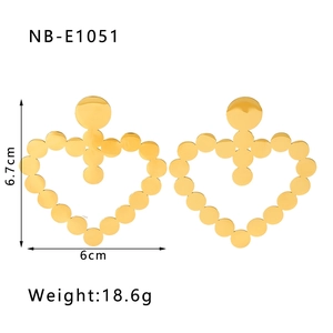 Detail view of 18k gold-plated hollow heart earrings with dimensions 6.7cm by 6cm
