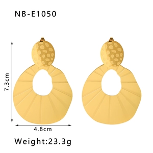 Detailed view of large U-shaped hollow gold drop earrings with 7.3cm height measurements