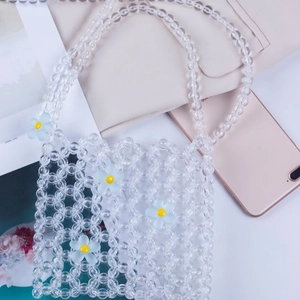 Handmade clear acrylic beaded mini crossbody bag with light blue floral decorations