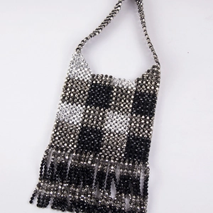 Handmade checkerboard beaded handbag with silver tassels and woven shoulder strap